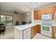 Kitchen features a breakfast bar and opens to the living room at 7219 Hamilton Rd # 7219, Bradenton, FL 34209