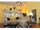 Spacious living room with large windows, neutral colored furniture, and hardwood floors at 3230 Jademoor Cir, Palm Harbor, FL 34685