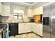 Bright eat-in kitchen, featuring updated cabinetry and stainless steel appliances at 3230 Jademoor Cir, Palm Harbor, FL 34685