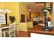 View of the dining room, kitchen pass through, and living room at 3230 Jademoor Cir, Palm Harbor, FL 34685