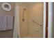 Walk-in shower with grab bar for accessibility at 3230 Jademoor Cir, Palm Harbor, FL 34685