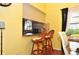 Two kitchen bar stools at a small pass through kitchen counter at 3230 Jademoor Cir, Palm Harbor, FL 34685