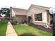 Exterior view of home with walkway and landscaping at 3230 Jademoor Cir, Palm Harbor, FL 34685