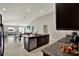 Open concept kitchen with an island, stainless steel appliances, and granite countertops at 13573 Willow Bluestar Loop, Riverview, FL 33579
