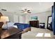 Spacious main bedroom with dresser and large bed at 13573 Willow Bluestar Loop, Riverview, FL 33579