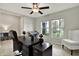 Bright home office with a large desk, comfortable chair, and natural light at 13573 Willow Bluestar Loop, Riverview, FL 33579
