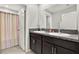 Bathroom with double vanity and shower/tub combo at 13573 Willow Bluestar Loop, Riverview, FL 33579
