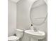 Clean powder room with pedestal sink and toilet at 13573 Willow Bluestar Loop, Riverview, FL 33579