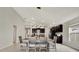 Dining area with farmhouse table, adjacent to the kitchen at 13573 Willow Bluestar Loop, Riverview, FL 33579
