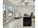 Home office featuring a desk, chair, and plenty of natural light at 13573 Willow Bluestar Loop, Riverview, FL 33579