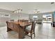 Open concept dining room with wooden table and seating for six at 13573 Willow Bluestar Loop, Riverview, FL 33579