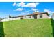 Large backyard with spacious grassy area at 13573 Willow Bluestar Loop, Riverview, FL 33579