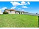Large backyard with spacious grassy area at 13573 Willow Bluestar Loop, Riverview, FL 33579