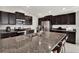 Modern kitchen with stainless steel appliances and granite countertops at 13573 Willow Bluestar Loop, Riverview, FL 33579