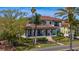 Two-story home with a tiled roof and lush landscaping at 2030 Coffee Pot Ne Blvd, St Petersburg, FL 33704