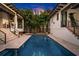 Private oasis with pool and spa, framed by the home at 2030 Coffee Pot Ne Blvd, St Petersburg, FL 33704