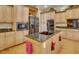 Kitchen island with granite countertops and stainless steel appliances at 5909 Menorca Ln, Apollo Beach, FL 33572