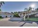 Impressive two-story home with three-car garage and manicured lawn at 5909 Menorca Ln, Apollo Beach, FL 33572