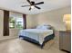 Bright bedroom with a king-size bed and tiled floors at 3365 39Th S St # C-1, St Petersburg, FL 33711