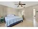 Spacious bedroom with a king-size bed and access to the kitchen at 3365 39Th S St # C-1, St Petersburg, FL 33711