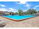 Relaxing community pool area with patio and landscaping at 3365 39Th S St # C-1, St Petersburg, FL 33711