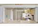 View into kitchen with yellow cabinets and white appliances at 3365 39Th S St # C-1, St Petersburg, FL 33711