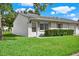 Front view of charming condo with lush landscaping at 3365 39Th S St # C-1, St Petersburg, FL 33711