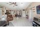 Open living room with tile floors, and access to the kitchen at 4398 Candler Ave, Spring Hill, FL 34609