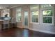 Kitchen with door leading to backyard and hardwood floors at 1408 W Azeele St, Tampa, FL 33606