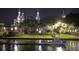 Night view of a boat on the river with people relaxing on the shore near historic buildings at 1408 W Azeele St, Tampa, FL 33606