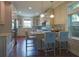 Modern kitchen with island, breakfast bar, and hardwood floors at 1408 W Azeele St, Tampa, FL 33606