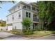 Three-story home with stone accents and a balcony at 1408 W Azeele St, Tampa, FL 33606