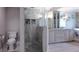 Elegant bathroom with a walk-in shower, vanity, and soaking tub at 1408 W Azeele St, Tampa, FL 33606