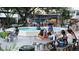 Relaxing outdoor plaza with a fountain, seating, and people enjoying the atmosphere at 1408 W Azeele St, Tampa, FL 33606