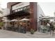 Outdoor restaurant patio with diners enjoying their meal under umbrellas at 1408 W Azeele St, Tampa, FL 33606