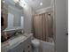 Bathroom with shower/tub combo and granite countertop at 1408 W Azeele St, Tampa, FL 33606