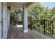 Peaceful balcony overlooking lush trees and providing ample shade at 1408 W Azeele St, Tampa, FL 33606