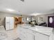 Modern kitchen with white island and granite countertops at 1009 Cobblestone Dr, Spring Hill, FL 34606