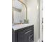 Bathroom with vanity and gold framed mirror at 1009 Cobblestone Dr, Spring Hill, FL 34606