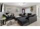 Comfortable living room with sectional sofa and accent chairs at 1009 Cobblestone Dr, Spring Hill, FL 34606