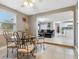 Open concept dining area with view into living room and kitchen at 1009 Cobblestone Dr, Spring Hill, FL 34606