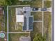 Top-down view of house with solar panels and a backyard pool at 1009 Cobblestone Dr, Spring Hill, FL 34606