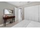 Bedroom with king-size bed, TV, and built-in closet at 1009 Cobblestone Dr, Spring Hill, FL 34606