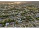 Wide aerial view of a house in a residential neighborhood at 1009 Cobblestone Dr, Spring Hill, FL 34606