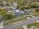 Aerial view of a renovated house with a large yard at 1009 Cobblestone Dr, Spring Hill, FL 34606