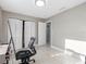 Bedroom with a built-in closet and home office space at 1009 Cobblestone Dr, Spring Hill, FL 34606