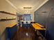 Open concept dining area with white countertops, bar seating, and wood accents at 100 4Th S Ave # 205, St Petersburg, FL 33701