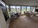 Spacious sunroom with golf course view and sewing station at 407 Stoneham Dr, Sun City Center, FL 33573