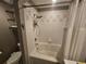 Bathroom with a bathtub, shower, and tiled walls at 100 4Th S Ave # 205, St Petersburg, FL 33701