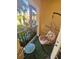 Relaxing balcony with hanging chair and small table, offering a tranquil outdoor space at 100 4Th S Ave # 205, St Petersburg, FL 33701